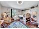 View of a bedroom featuring playful decor, wood floors, a modern ceiling fan, and plenty of storage at 9220 Old Cascade Dr, Garner, NC 27529