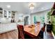 Open dining area with hardwood floors, French doors, and stylish décor at 9220 Old Cascade Dr, Garner, NC 27529