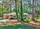 Inviting single-story home nestled among mature trees, featuring a quaint front porch at 9220 Old Cascade Dr, Garner, NC 27529