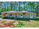 Charming single-story home with a welcoming front porch and well-maintained landscaping at 9220 Old Cascade Dr, Garner, NC 27529