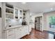 Modern kitchen featuring white cabinetry, stainless steel appliances, and granite countertops at 9220 Old Cascade Dr, Garner, NC 27529