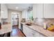 Bright kitchen featuring white cabinets, granite countertops, tile backsplash, and stainless steel appliances at 9220 Old Cascade Dr, Garner, NC 27529