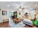 Bright living room featuring hardwood floors, a comfortable couch, and an open layout at 9220 Old Cascade Dr, Garner, NC 27529