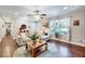 Cozy living room with hardwood floors, a large window, and stylish furniture at 9220 Old Cascade Dr, Garner, NC 27529