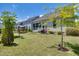 Well-maintained backyard with a screened porch, grilling area, and mature trees at 94 Two Creeks, Chapel Hill, NC 27517