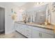 Bright bathroom features double sinks, granite countertops, and a large mirror at 94 Two Creeks, Chapel Hill, NC 27517