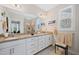 The primary bath has a double sink vanity with granite countertops, and lots of light at 94 Two Creeks, Chapel Hill, NC 27517