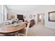Bonus room with a round wooden table, leather sofa, television, and neutral colored carpet at 94 Two Creeks, Chapel Hill, NC 27517