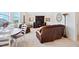 Bonus room with a round wooden table, leather sofa, television, and neutral colored carpet at 94 Two Creeks, Chapel Hill, NC 27517