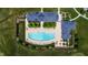 Overhead shot of the large community pool with lounge chairs, tables, and a recreation area at 94 Two Creeks, Chapel Hill, NC 27517
