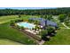 Aerial view of the community pool with lounge chairs, a covered pavilion, and lush landscaping at 94 Two Creeks, Chapel Hill, NC 27517