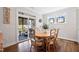Charming dining area with a wooden table, decorative chairs, and access to the outdoor patio at 94 Two Creeks, Chapel Hill, NC 27517