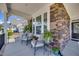 Cozy front porch with comfortable seating and decorative plants at 94 Two Creeks, Chapel Hill, NC 27517