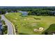 Aerial view of a well-maintained golf course, ponds, and winding cart paths at 94 Two Creeks, Chapel Hill, NC 27517