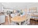 Open-concept kitchen with white cabinetry, stainless steel appliances, and easy access to the dining area at 94 Two Creeks, Chapel Hill, NC 27517