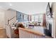 This home features a stylish living room with a fireplace, neutral palette, and plenty of seating at 94 Two Creeks, Chapel Hill, NC 27517