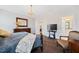 Serene main bedroom featuring a bed, dark wood floors, and en suite bath at 94 Two Creeks, Chapel Hill, NC 27517
