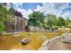 Scenic waterfall cascading into a serene pond, creating a tranquil and picturesque community amenity at 94 Two Creeks, Chapel Hill, NC 27517