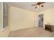 Spacious carpeted bedroom with ceiling fan and a window at 9408 Bells Valley Dr, Raleigh, NC 27617