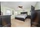 Bedroom with a ceiling fan, neutral carpeting, and a black dresser at 9408 Bells Valley Dr, Raleigh, NC 27617