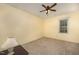 Bedroom with a window and neutral carpet. Ceiling fan is present at 9408 Bells Valley Dr, Raleigh, NC 27617
