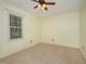 Bedroom with neutral walls, carpeting, a ceiling fan and a window at 9408 Bells Valley Dr, Raleigh, NC 27617
