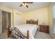Comfortable bedroom featuring a ceiling fan, neutral walls, and a cozy bed at 9408 Bells Valley Dr, Raleigh, NC 27617