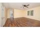 Spacious bedroom with wood floors, a ceiling fan, and plenty of natural light at 9408 Bells Valley Dr, Raleigh, NC 27617