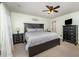 Bedroom featuring a ceiling fan, neutral carpeting, and a black dresser at 9408 Bells Valley Dr, Raleigh, NC 27617