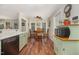 Charming dining area features a wooden table, chairs, and natural light from adjacent windows at 9408 Bells Valley Dr, Raleigh, NC 27617