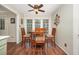 Inviting dining area with wooden table and chairs, enhanced by natural light from bright windows at 9408 Bells Valley Dr, Raleigh, NC 27617