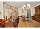 Lovely dining area featuring a wooden table, chandelier, and staircase view at 9408 Bells Valley Dr, Raleigh, NC 27617