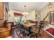 Dining area with wooden table, decorative accents, and natural light streaming through the window at 9408 Bells Valley Dr, Raleigh, NC 27617