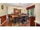 Elegant dining room with a large wooden table, seating for eight, and traditional decor at 9408 Bells Valley Dr, Raleigh, NC 27617