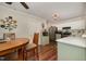 Bright kitchen with white cabinets, stainless steel appliances, and an adjacent eat-in area at 9408 Bells Valley Dr, Raleigh, NC 27617