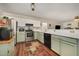 Well-equipped kitchen featuring modern appliances, ample counter space, and open to the living area at 9408 Bells Valley Dr, Raleigh, NC 27617