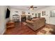 Comfortable living room with a cozy fireplace, hardwood floors, and plenty of natural light at 9408 Bells Valley Dr, Raleigh, NC 27617