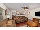 Comfortable living room with brown sofas, hardwood floors, and an open view to the kitchen at 9408 Bells Valley Dr, Raleigh, NC 27617