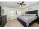 Serene main bedroom with a large bed, soft carpet, natural light, and ample space for relaxation at 9408 Bells Valley Dr, Raleigh, NC 27617