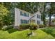 Well-maintained two-story home with green lawn, showcasing the yard with landscaping at 9408 Bells Valley Dr, Raleigh, NC 27617