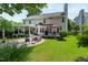 Spacious backyard with patio, seating, grill, and lush lawn at 9517 Candor Oaks Dr, Raleigh, NC 27615