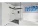 Bathroom featuring a glass-enclosed shower and a soaking tub with white tile surround at 9517 Candor Oaks Dr, Raleigh, NC 27615