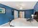 Spacious bedroom with plush carpeting, white trim, and ceiling fan at 9517 Candor Oaks Dr, Raleigh, NC 27615