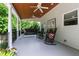 Large, covered deck features white pillars, ceiling fans, and swing at 9517 Candor Oaks Dr, Raleigh, NC 27615
