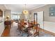 Elegant dining room featuring hardwood floors and an open view to the living spaces at 9517 Candor Oaks Dr, Raleigh, NC 27615