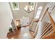 Bright two-story foyer boasts hardwood floors, staircase, and natural light from large windows at 9517 Candor Oaks Dr, Raleigh, NC 27615