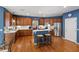 Well-appointed kitchen with wooden cabinets, stainless steel appliances, and a breakfast bar at 9517 Candor Oaks Dr, Raleigh, NC 27615