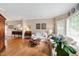 Comfortable living room featuring hardwood floors, neutral tones, and ample natural light at 9517 Candor Oaks Dr, Raleigh, NC 27615