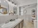 Bathroom with double sink vanity and stylish mirrors at 1003 W Divine St, Dunn, NC 28334