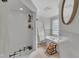 Bright bathroom features a soaking tub, stand up shower, and decorative window at 1003 W Divine St, Dunn, NC 28334
